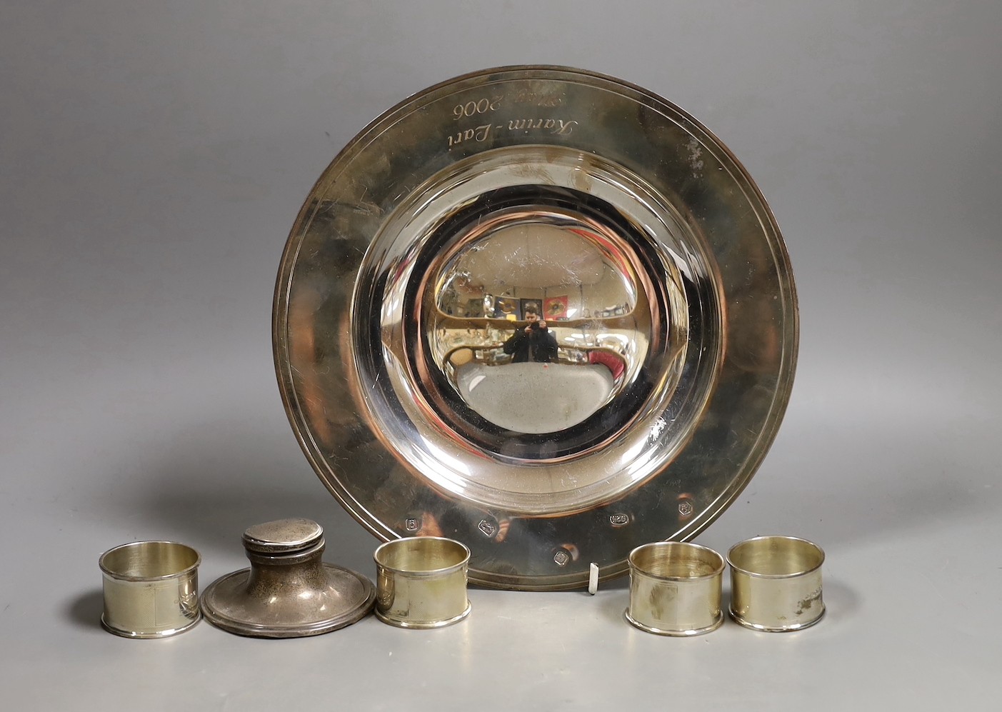 A modern silver armada dish by Carr's of Sheffield, 25.5cm, a similar set of four napkin rings and a silver mounted inkwell